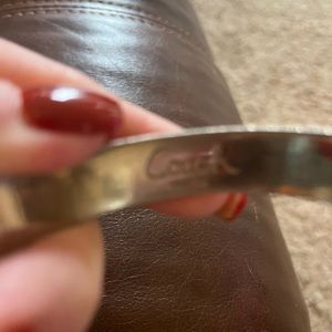 Women’s coach cuff sterling silver bracelet.